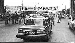 photo shows street protest with banners reading, "U.S. Out of Nicaragua" etc.